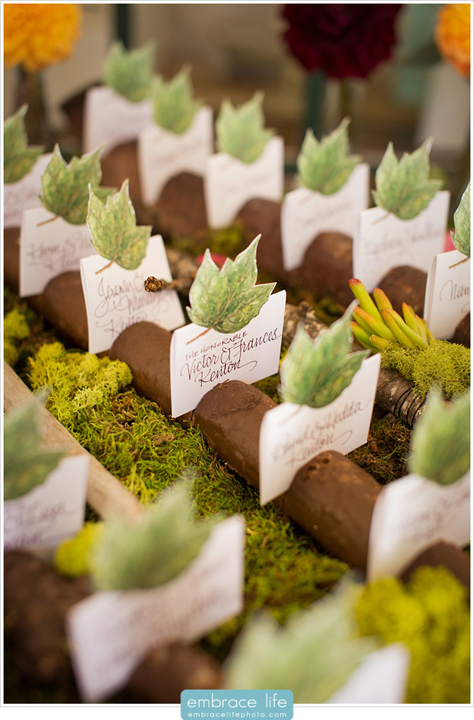 Rustic Escort Cards Featuring Organic Elements Like Moss, Wood and Leaves