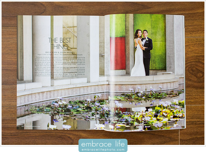 Bride and groom pose in front of colorful wall and reflecting pond at their Skirball Cultural Center wedding